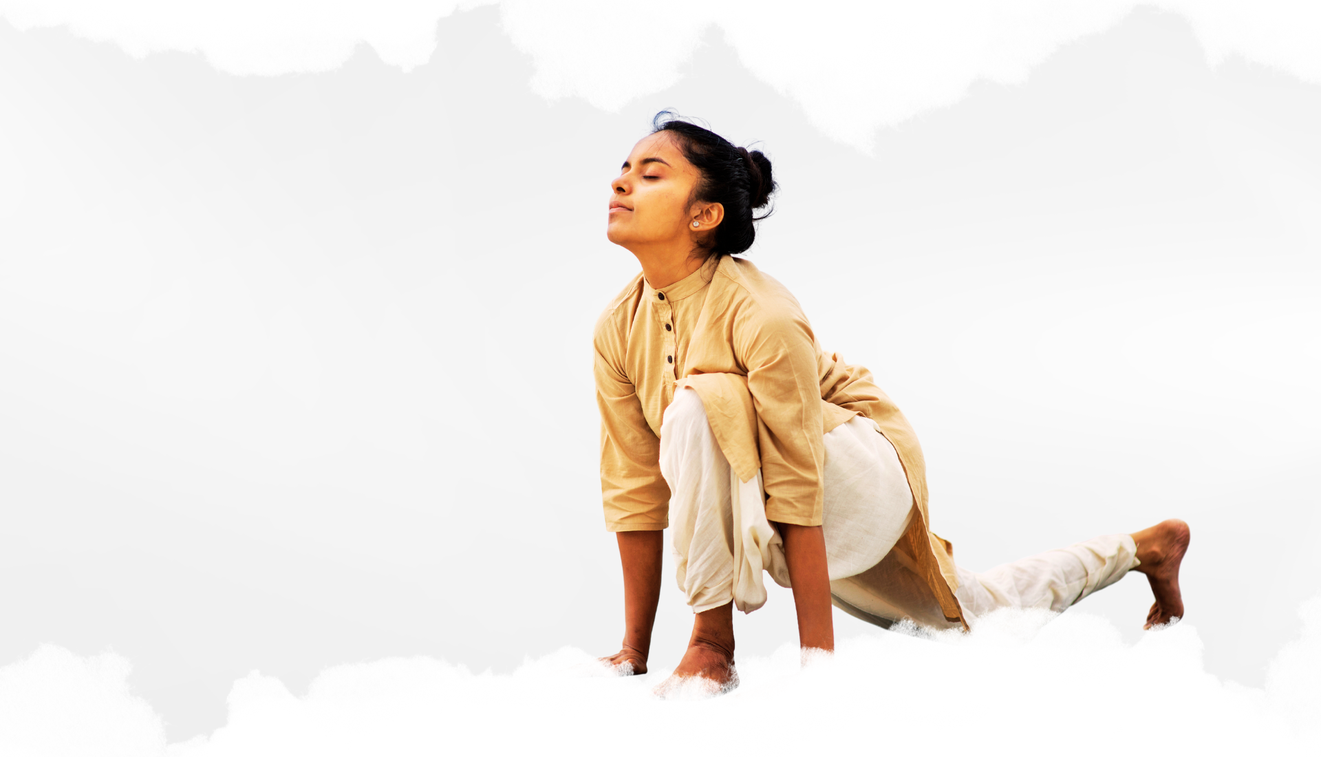 Woman practicing Isha Surya Kriya yoga pose, demonstrating strength, balance, and inner focus in a traditional attire.