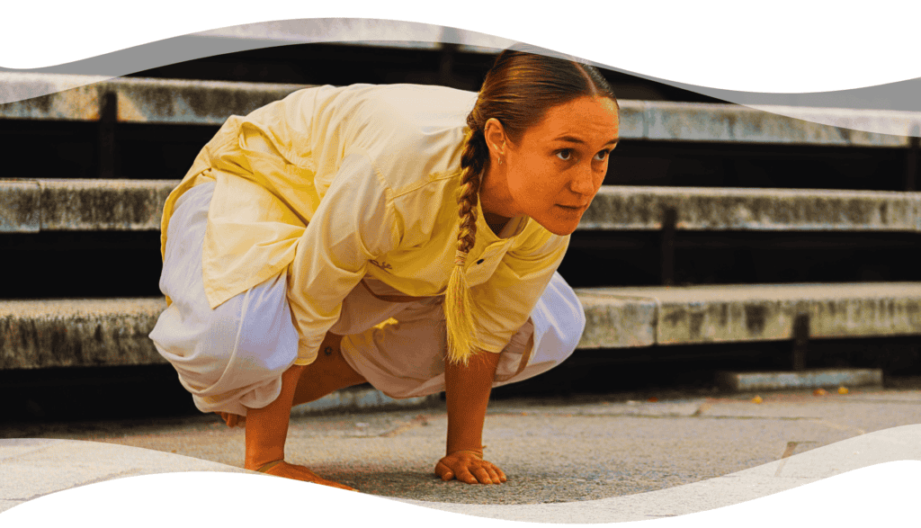 Person practicing Yogasanas outdoors in a focused posture, representing classical Hatha Yoga structured by Sadhguru for balance, alignment, and inner stillness.